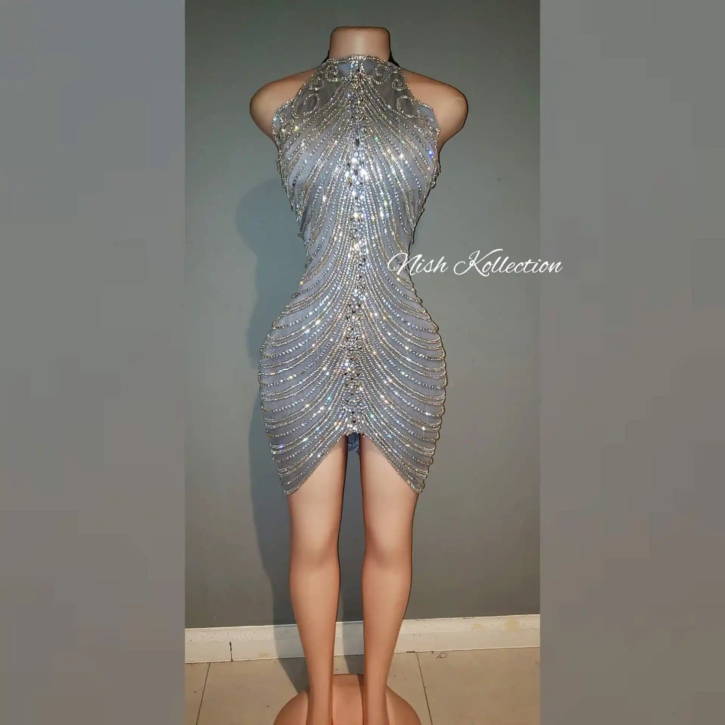 Front view of Diamond V Zena Rhinestone Dress with halter neckline and nude illusion base
