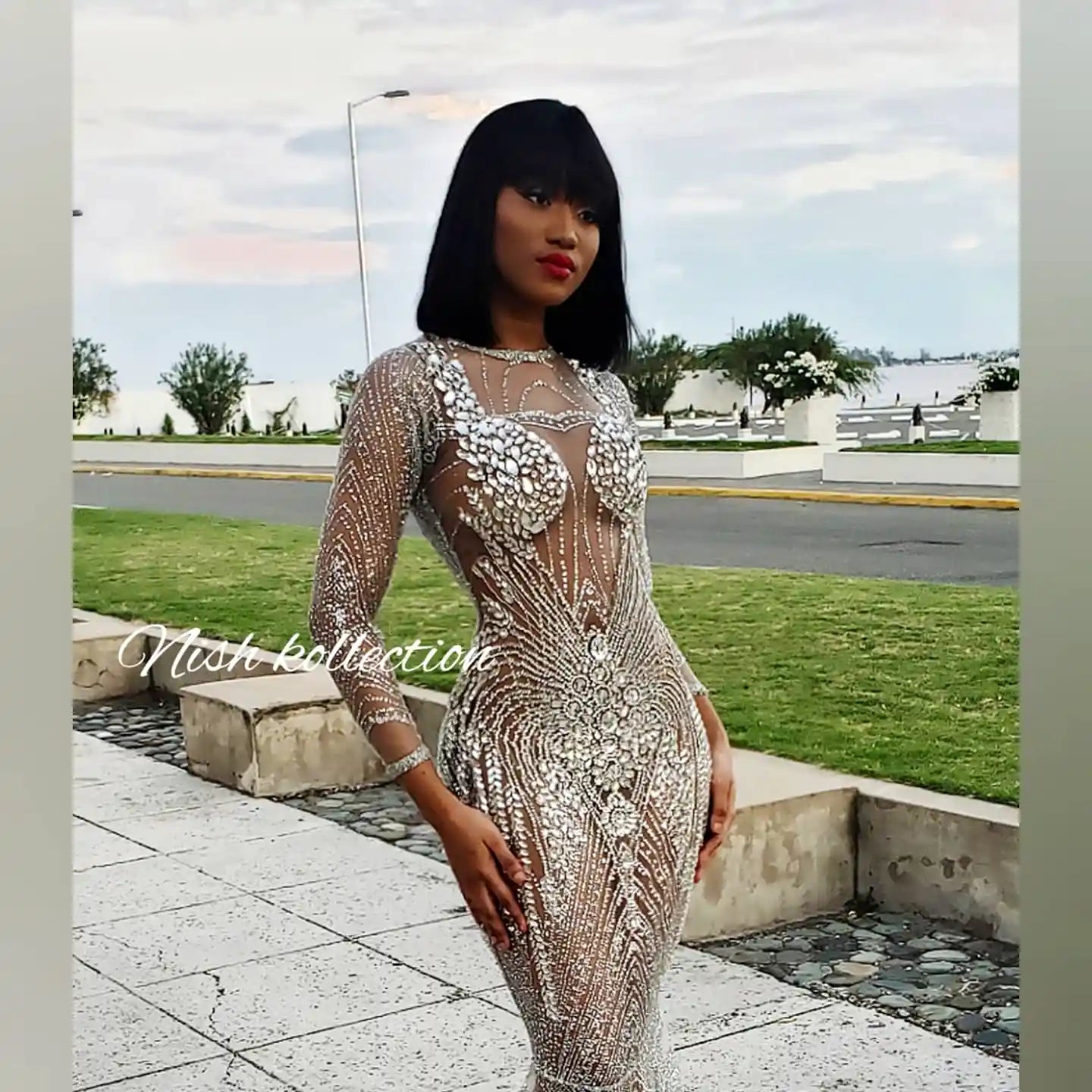 Close-up of glitter and rhinestone detailing on silver mermaid gown