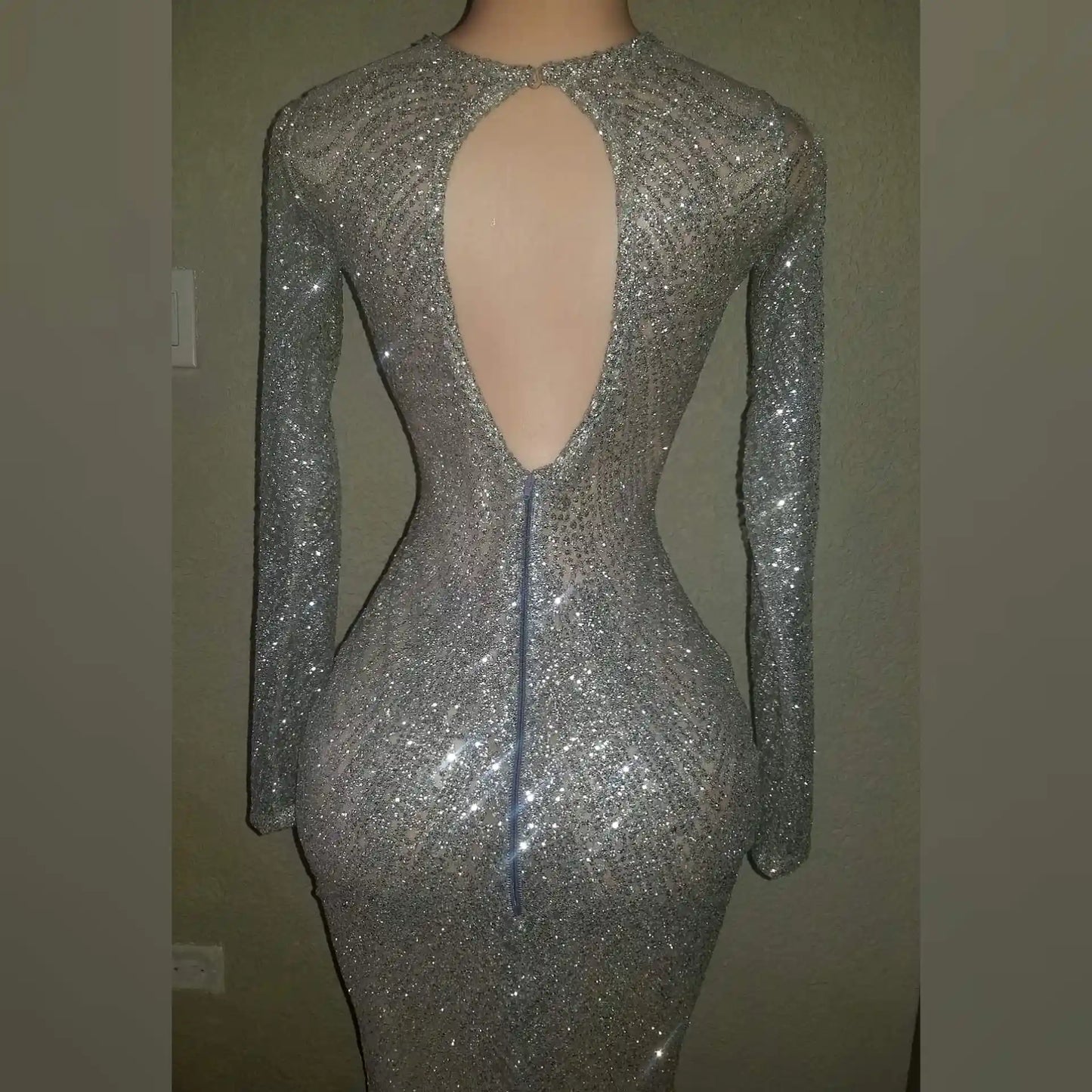 Back view of London Shimmer Mermaid Dress with zip closure and elegant back cutout.