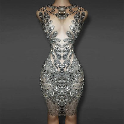 Model wearing Naijah Rhinestone Mini Dress in sheer crystal mesh – front view